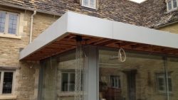 Flat roof fascia-rain chain installation