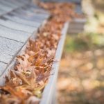 blocked gutters filled with leaves