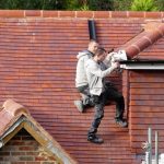 two gutter cleaning professionals