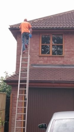 man fixing gutter