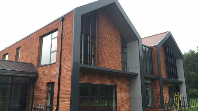 Commercial box gutter and square downpipe installation
